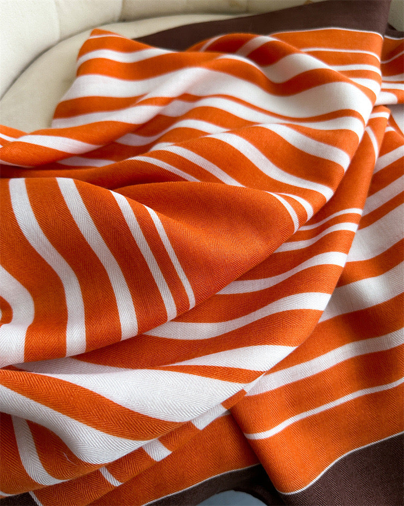 Geometric stripe viscose cotton stole fabric detail - orange white chevron pattern with soft drape