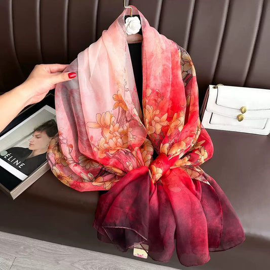 Pink coral burgundy ombre floral print organza silk scarf with magnolia flowers - hand holding scarf close-up