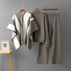 Grey knit mock-neck co-ord set with white and grey statement drape