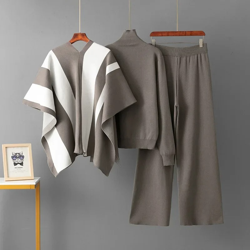 Grey knit mock-neck co-ord set with white and grey statement drape