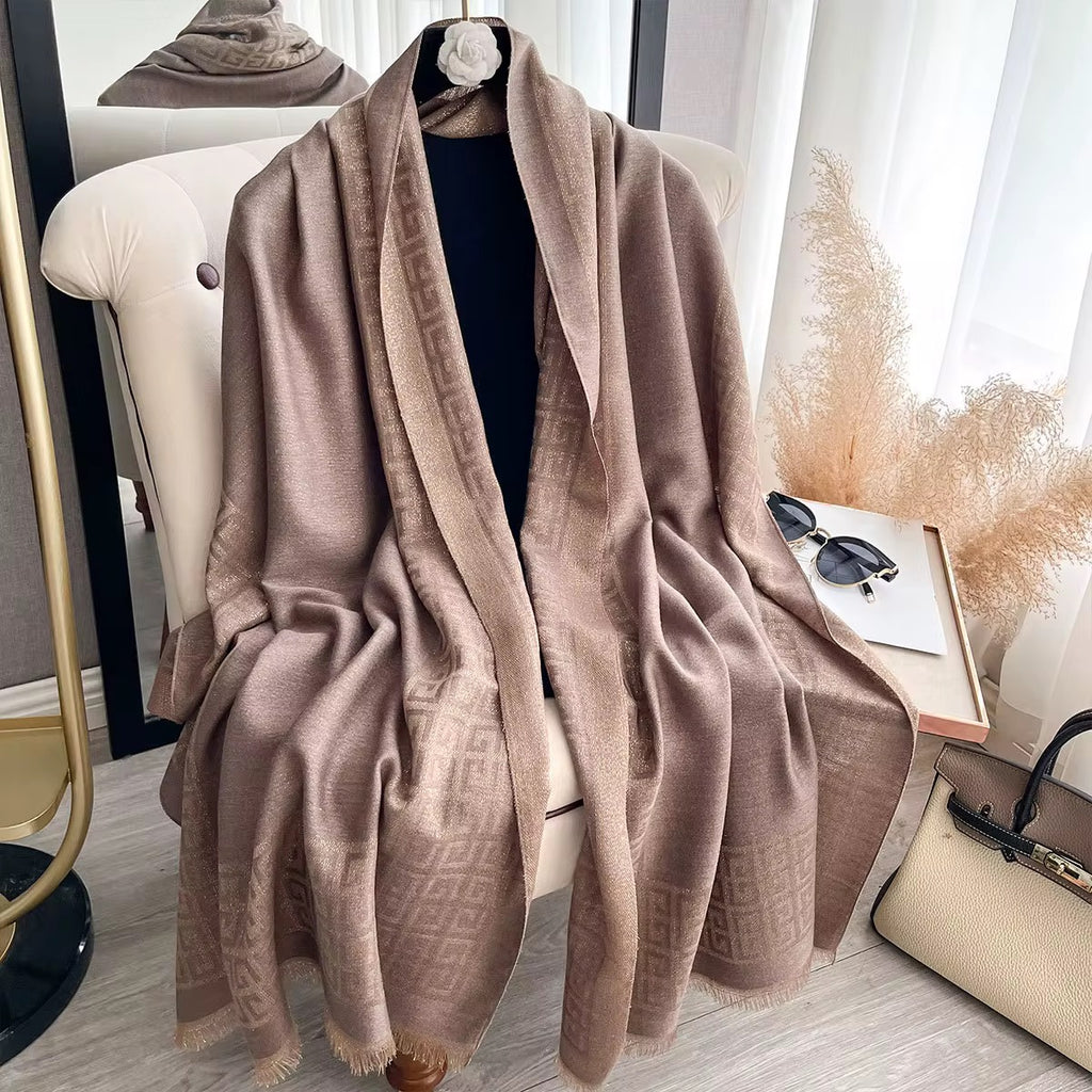 Beige scarf draped over a chair in a room with decor elements.