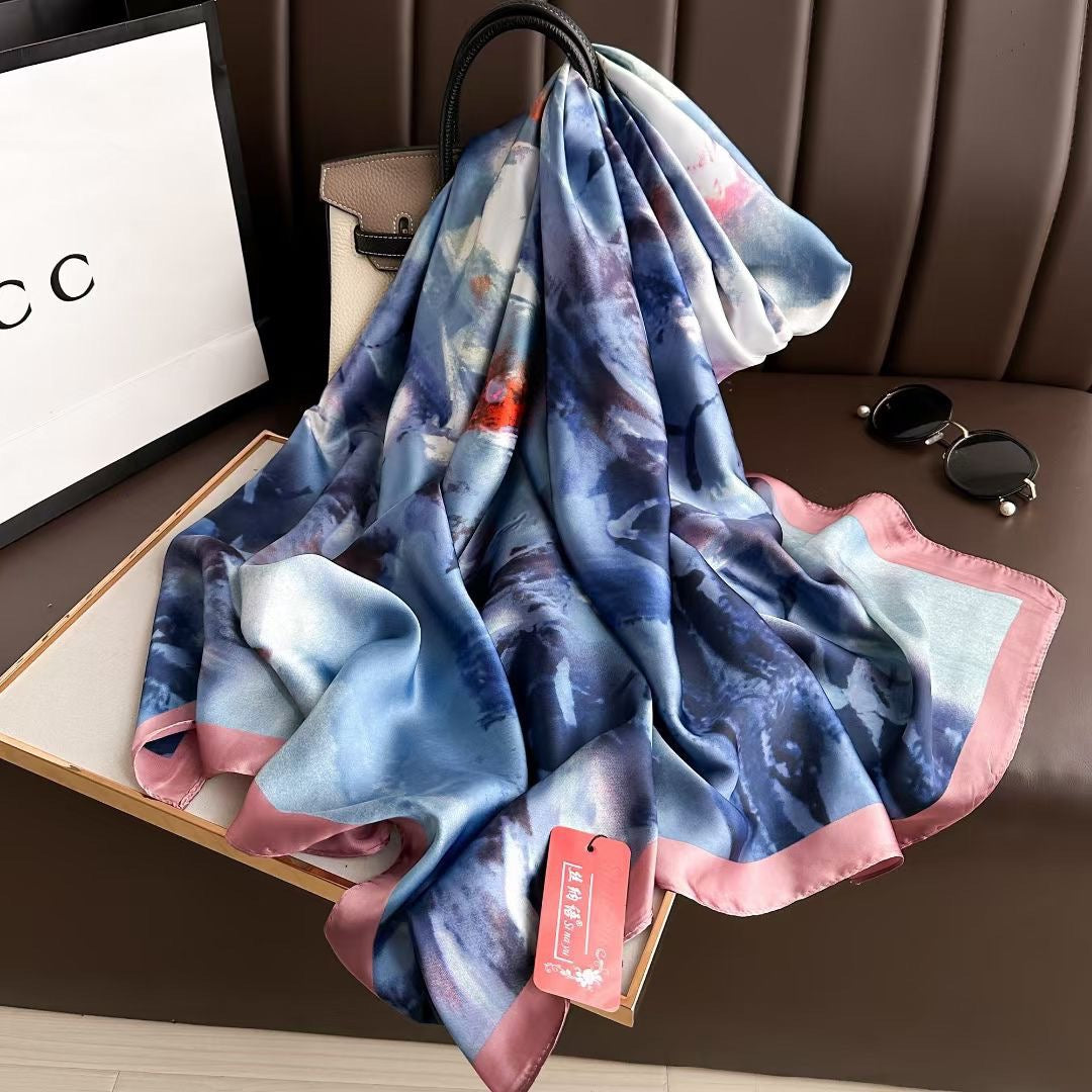 Multicolored scarf with a tag on a brown surface