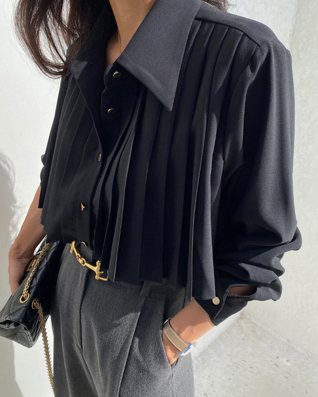 Black pleated cape collar polyblend shirt styled with black pants - professional office look