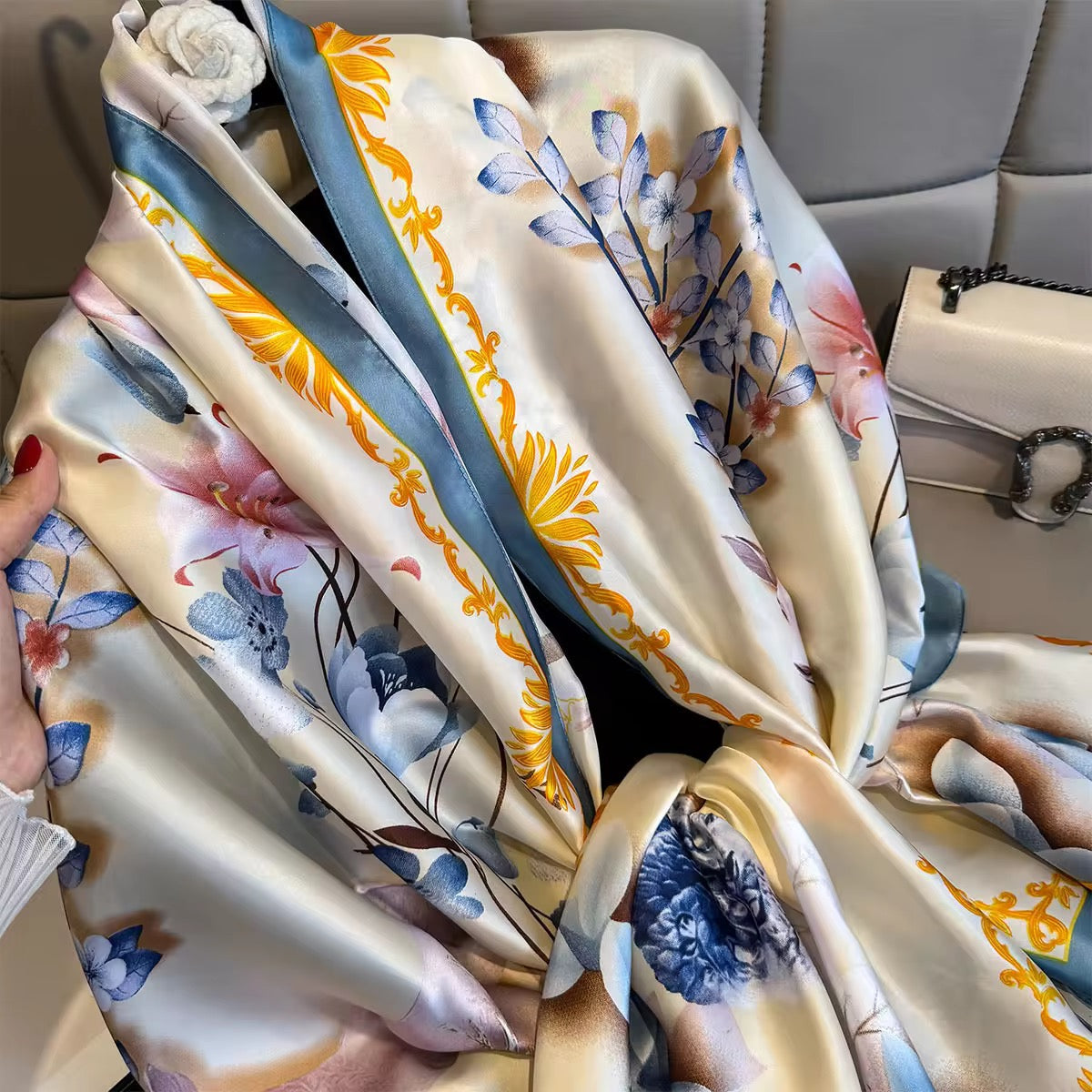 Floral patterned fabric draped over a car seat