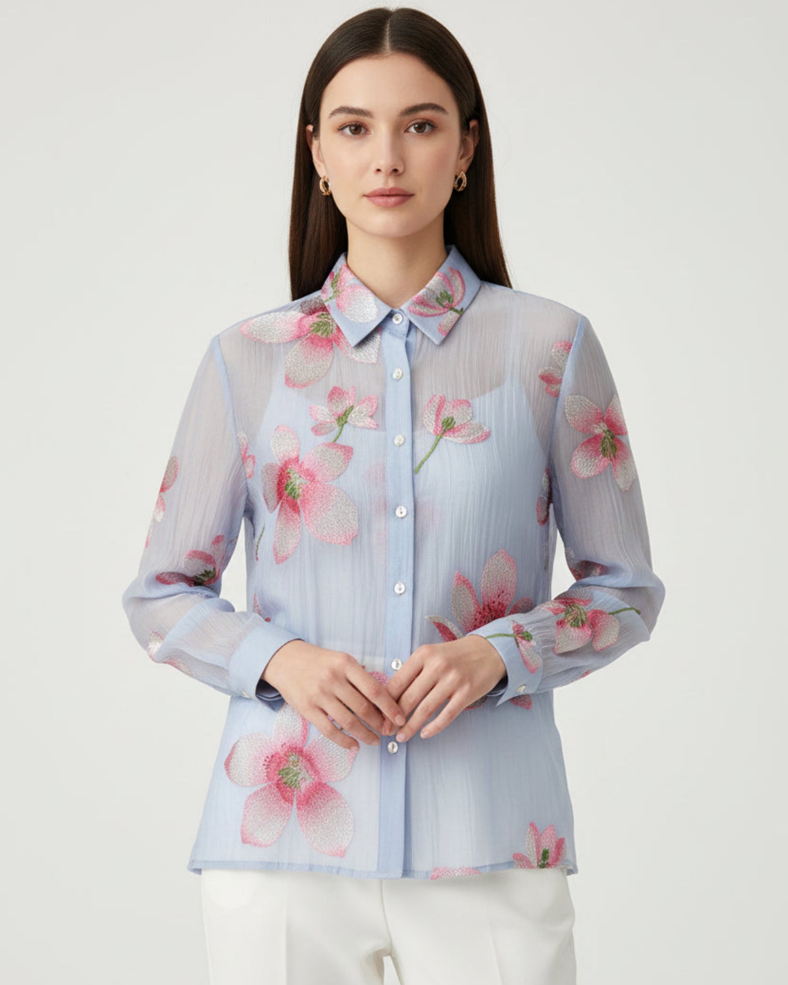 Floral embroidered shirt on a wooden surface
