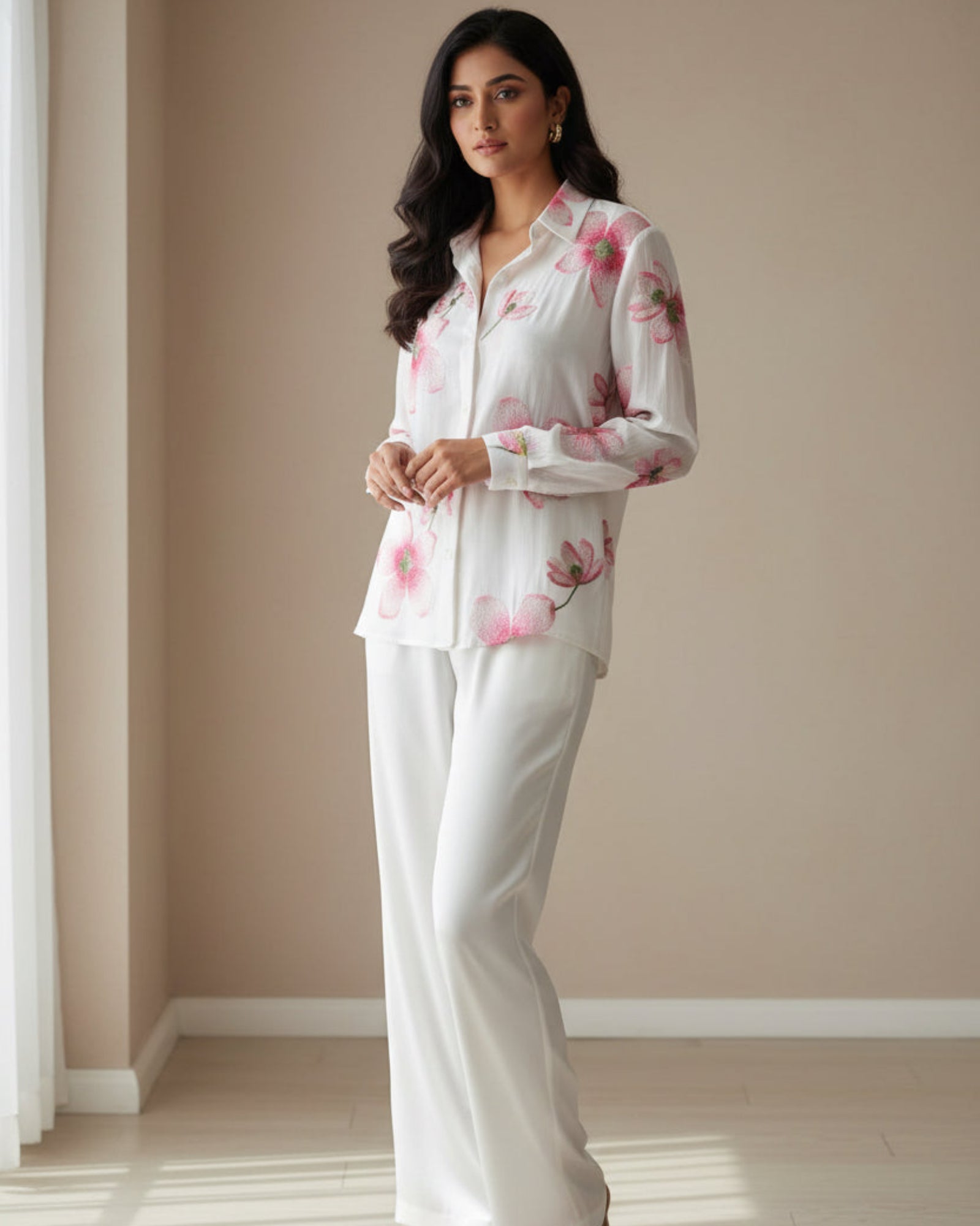 Floral shirt with pink flowers on a light wooden surface