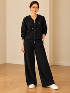 Chic ribbed knit hooded leisure suit for women in classic black with zip-up hoodie and wide-leg pants