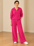 Chic ribbed knit hooded leisure suit for women in fuchsia pink with zip-up hoodie and wide-leg pants