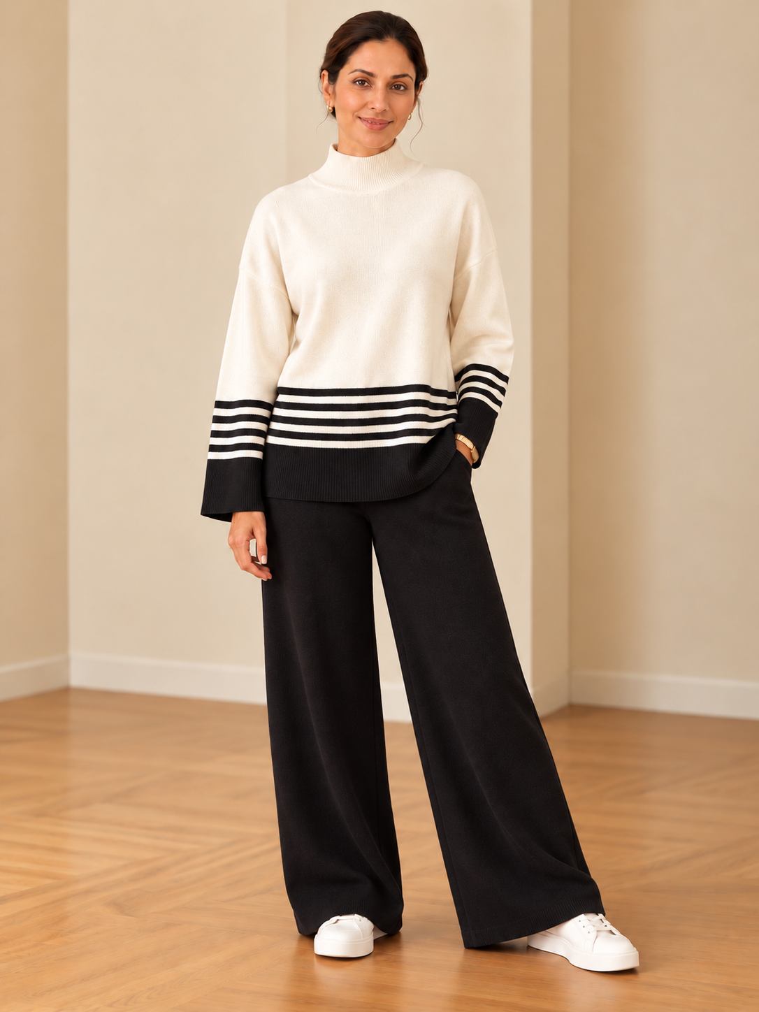 Cozy knit two-piece loungewear set for women in black and ivory with striped sweater and wide-leg pants