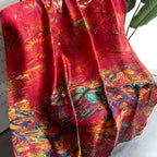 Crimson Royale Printed Silk Stole elegantly draped indoors showing full artistic multicolour print on deep crimson imitation satin silk

