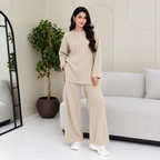 Dart ribbed knitted woollen co-ord set for women in cream, featuring a relaxed long-sleeve top and wide-leg bottom