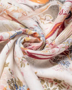 Close-up of a folded floral patterned fabric with soft colors.