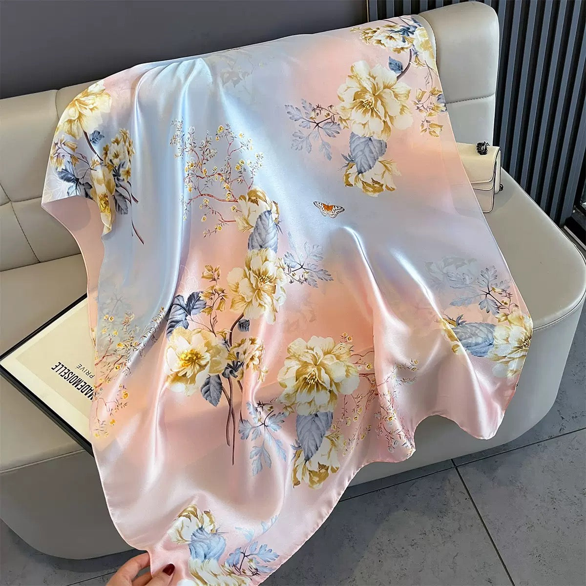 Floral-patterned blanket draped over a sofa