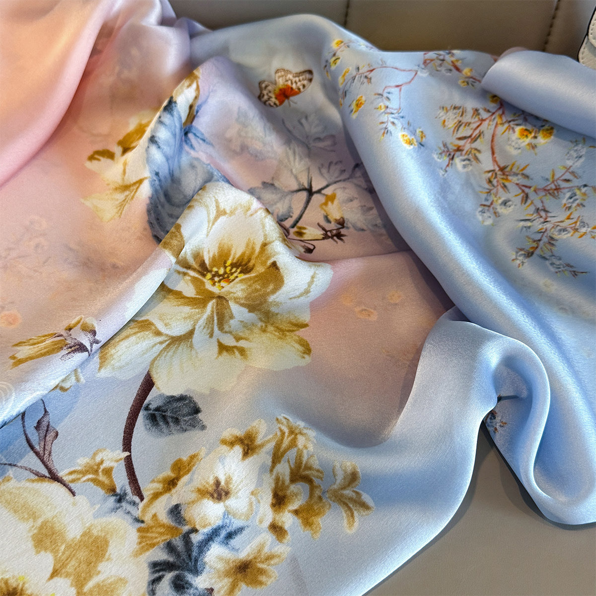 Floral-patterned fabric with yellow flowers and blue background