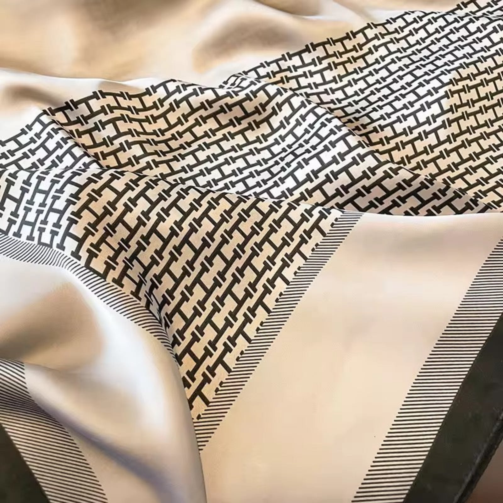 Close-up of fabric with geometric pattern on a beige background