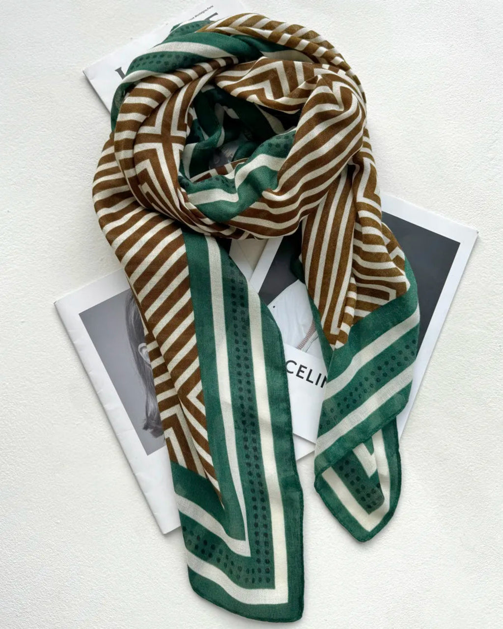 Striped scarf with brown, green, and white pattern