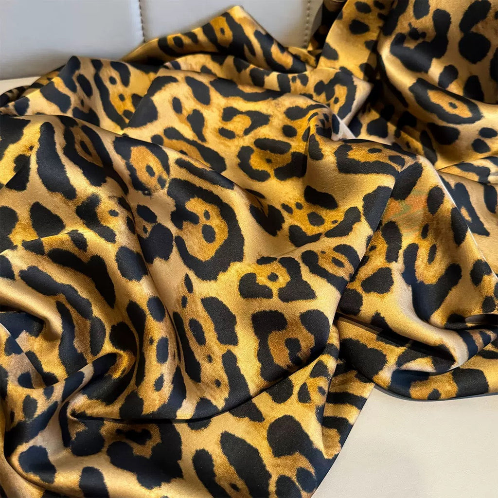 Leopard print fabric with a soft texture on a white background