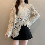 Scalloped floral lace top in cream styled with black mini skirt
