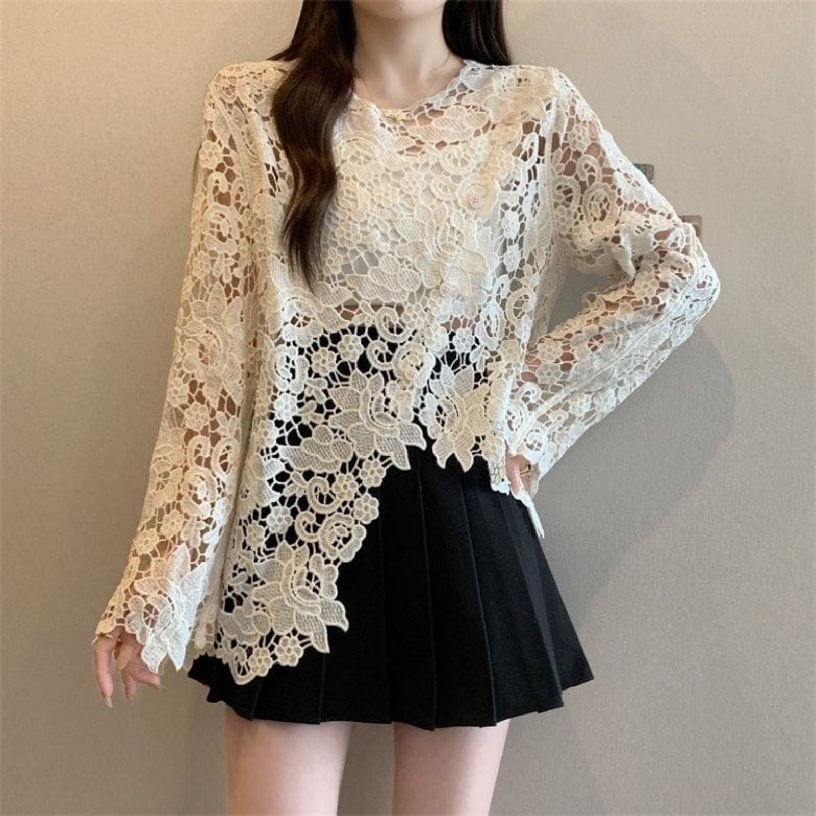 Scalloped floral lace top in cream styled with black mini skirt