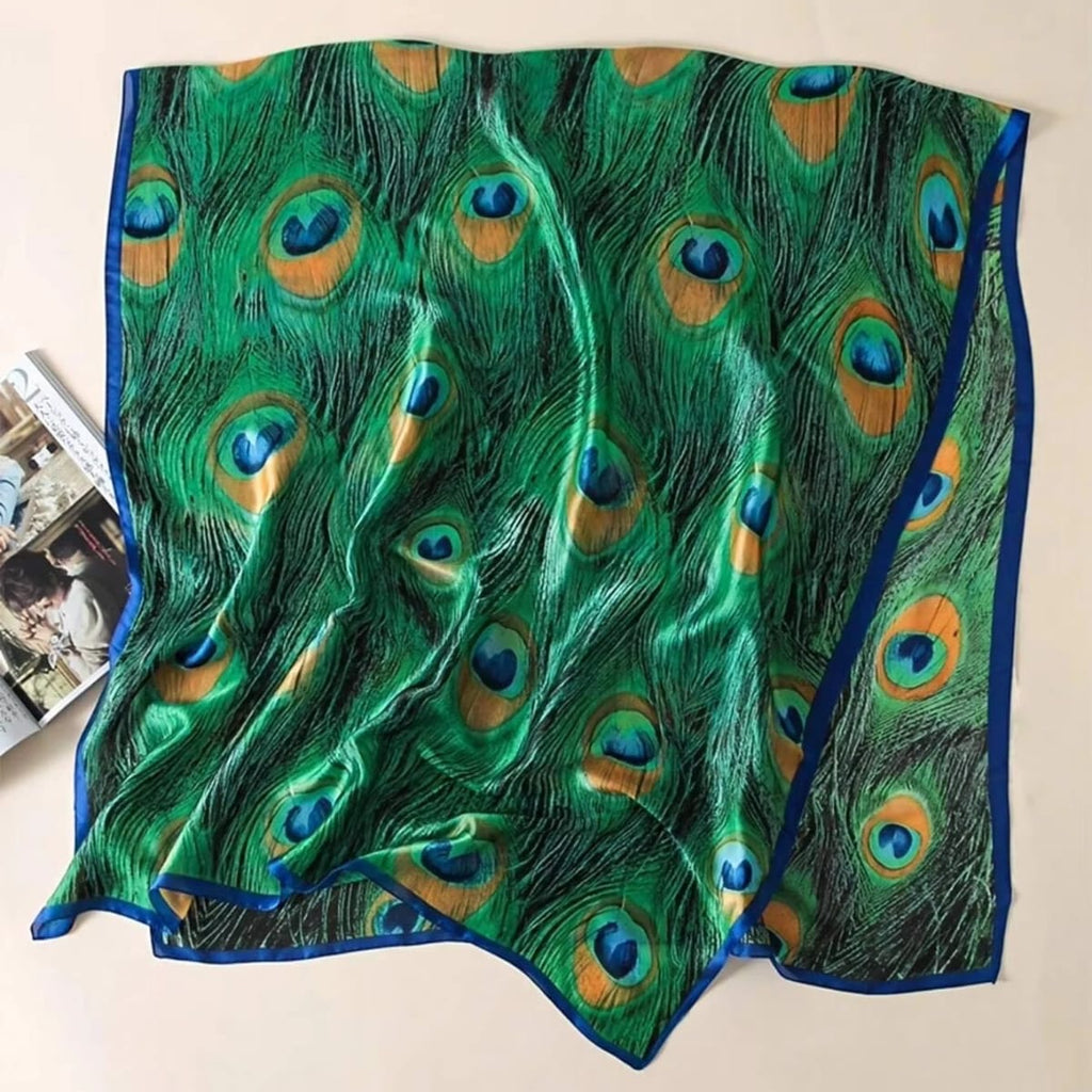 Peacock feather patterned fabric on a plain background