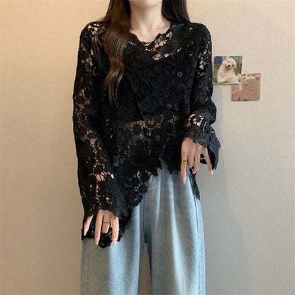 Scalloped floral lace top in black paired with wide-leg jeans