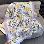 Floral patterned scarf draped over a sofa