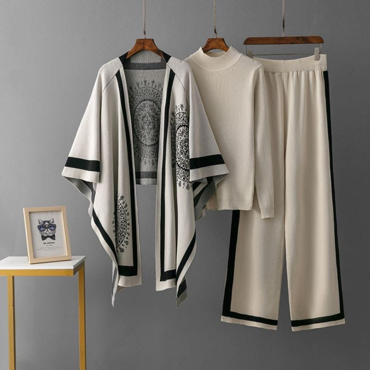 Luxury knit 3-piece co-ord set for women in ivory and black with printed cape, knitted top and wide-leg pants