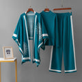 Luxury knit 3-piece co-ord set for women in teal and white with printed cape, knitted top and wide-leg pants