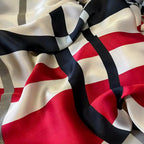 Close-up of a fabric with red, black, and white pattern