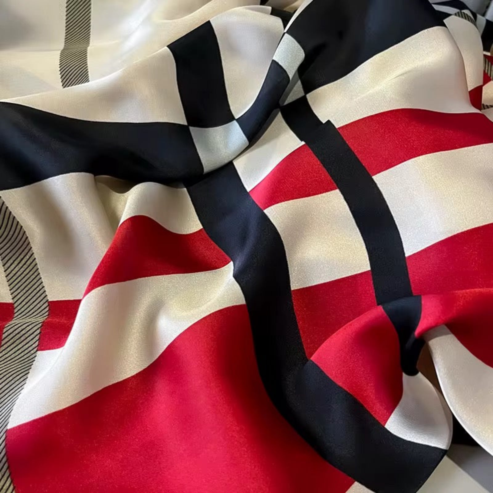 Close-up of a fabric with red, black, and white pattern