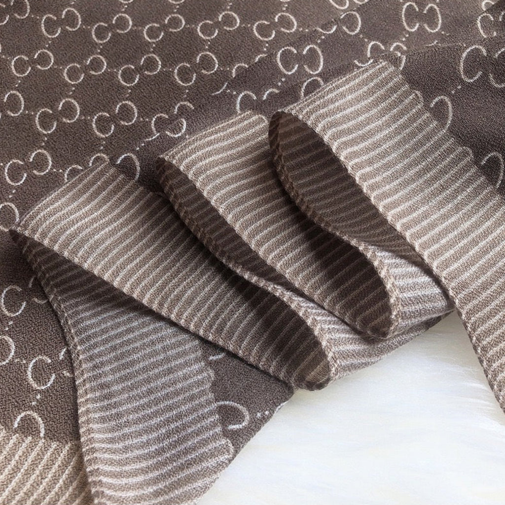 Brown textured fabric with a subtle pattern on a white background