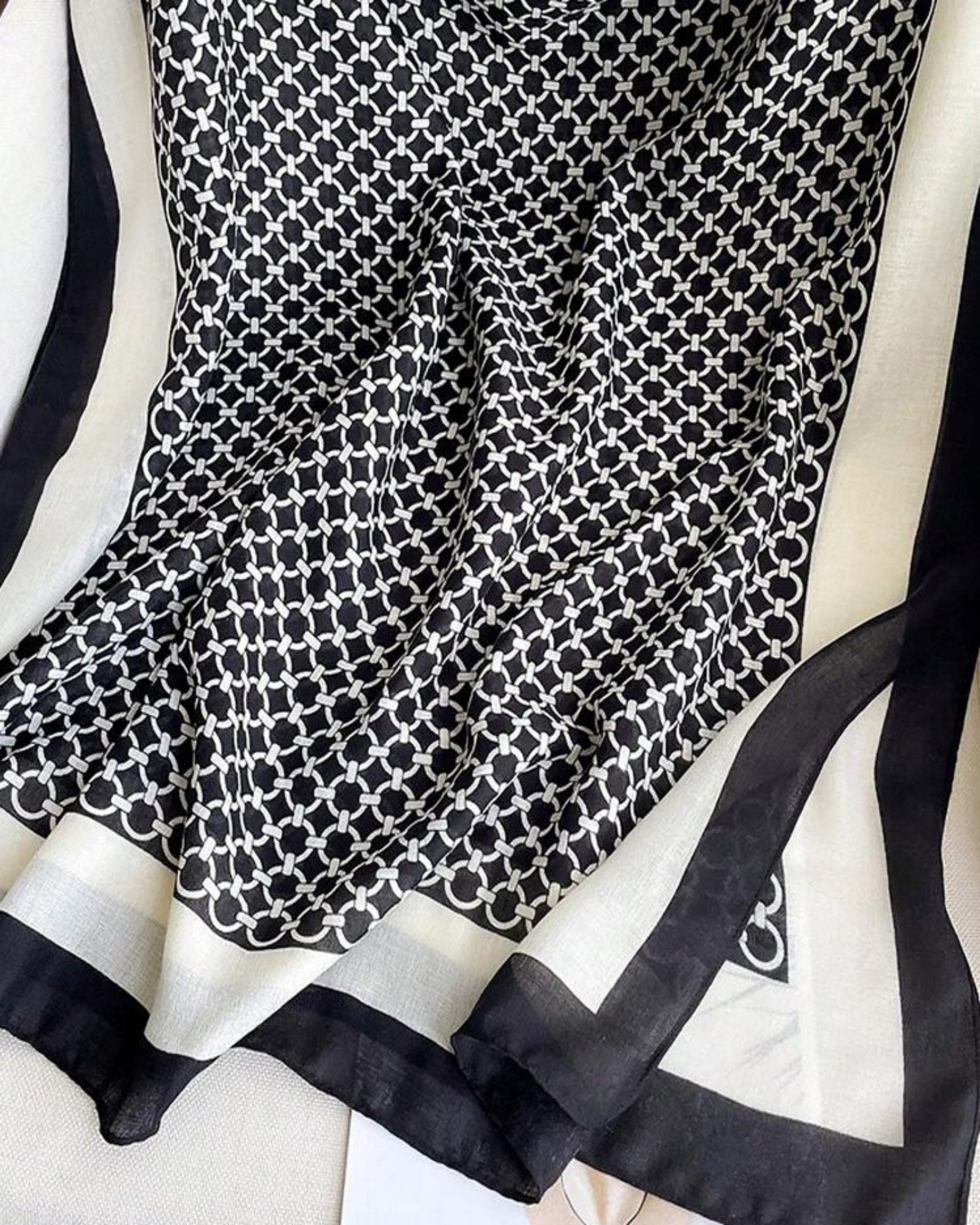 Monochrome chain print cotton stole with black and white border made from soft viscose fabric
