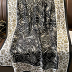Decorative fabric with intricate paisley pattern on a chair