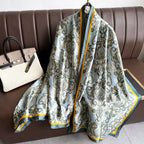 Patterned scarf draped over a chair with a handbag beside it