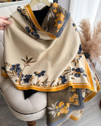 Floral patterned scarf draped over a chair with a neutral background