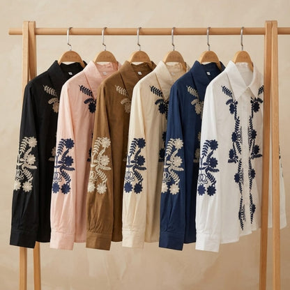 The Jardin Embroidered Cotton Shirt — all 6 colour variants displayed on wooden clothing rack