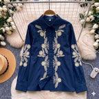 Jardin Embroidered Shirt in Noir — black base with cream and navy botanical floral embroidery, front view