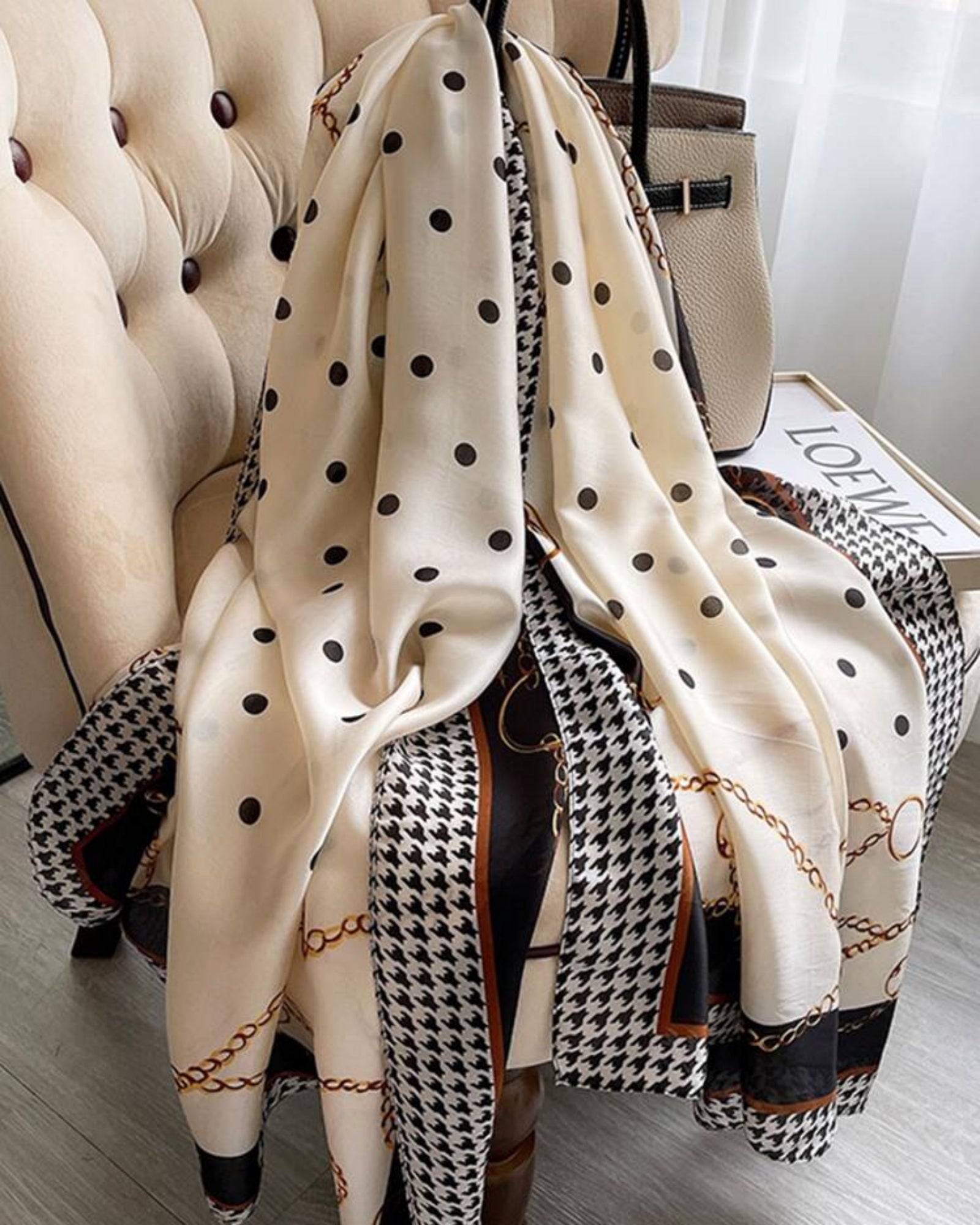 Detail shot of gold chain and houndstooth border on The Maison Trio Silk Scarf