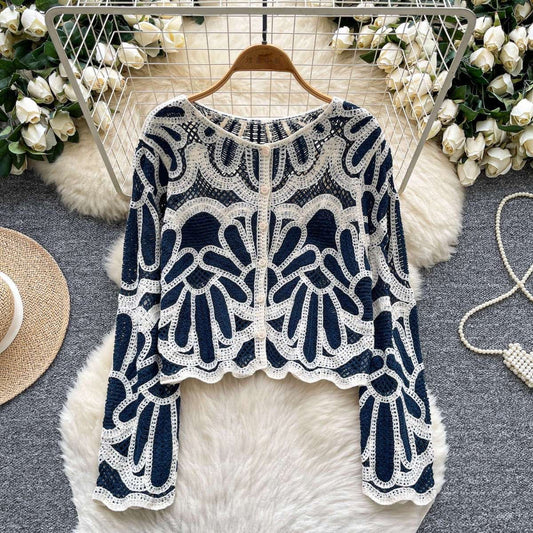 Riviera Fan Cardigan styled with denim shorts — front button closure detail