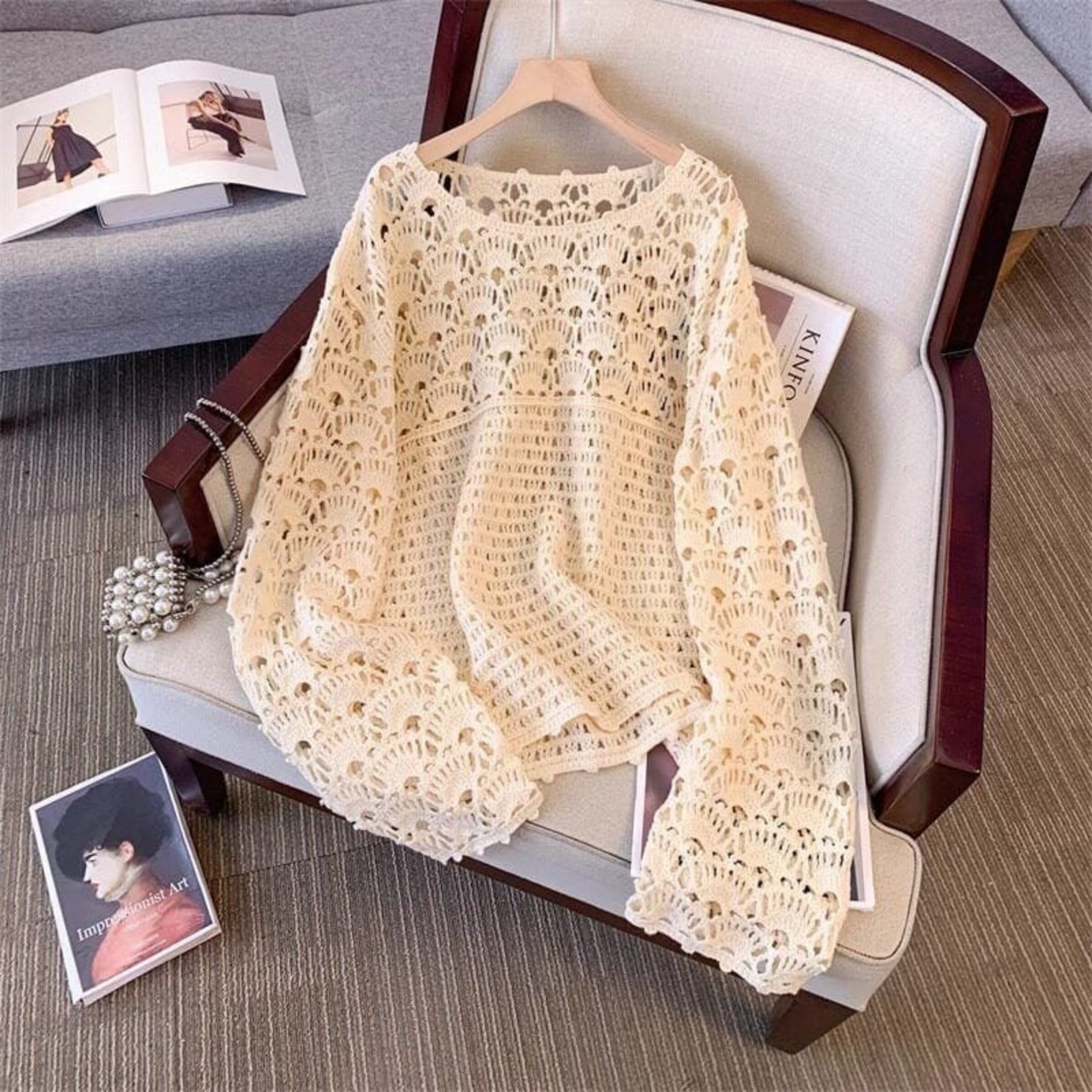 The Rosette Hollow Crochet Pullover in Ivory, artisan hollow crochet knit top with scalloped edges and bell sleeves, women's boho layering piece