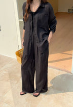 Soleil Co-ord Set in Onyx — black crinkle cotton shirt and wide-leg pants, minimal outdoor setting
