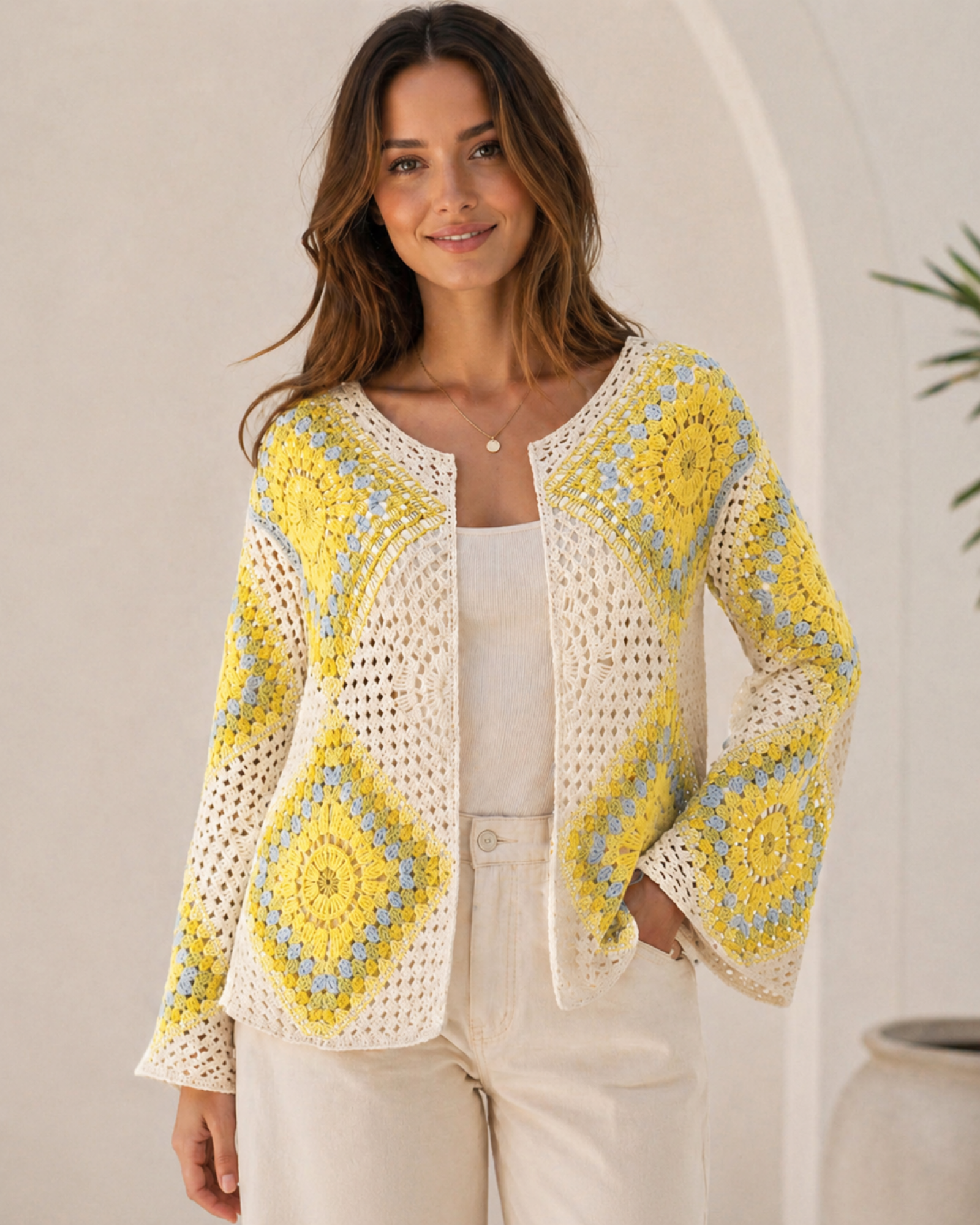 The Soleil Granny Square Crochet Jacket in Sunshine Yellow colourway — open-weave granny square crochet cardigan with yellow and powder blue mandala panels on cream base, long flared bell sleeves, boho layering piece for women, free size