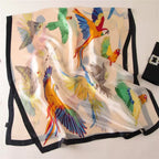 Silk scarf with colorful parrot design on a white background