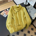 Close-up of yellow-green textured knit sweater showing the coordinating scarf and button detail