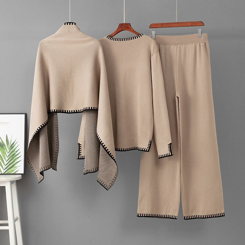 Close view of The Atelier Edge knit co ord set shawl and contrast edging