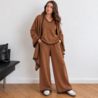 Woman wearing The Atelier Edge Mocha Brown 3 piece knit co ord set with shawl