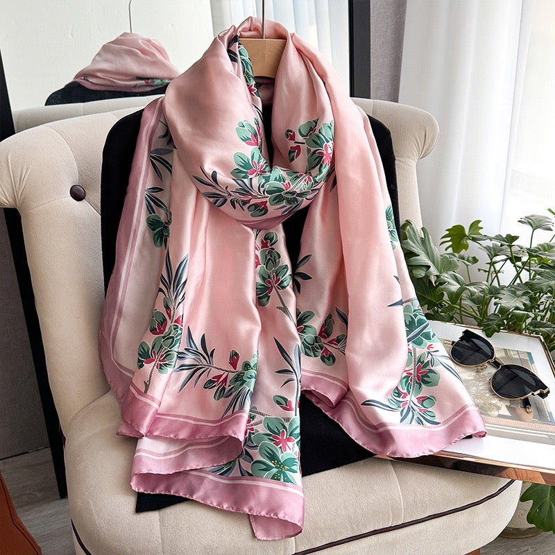 Aveline Blush Bloom Scarf displayed on chair showing floral border print