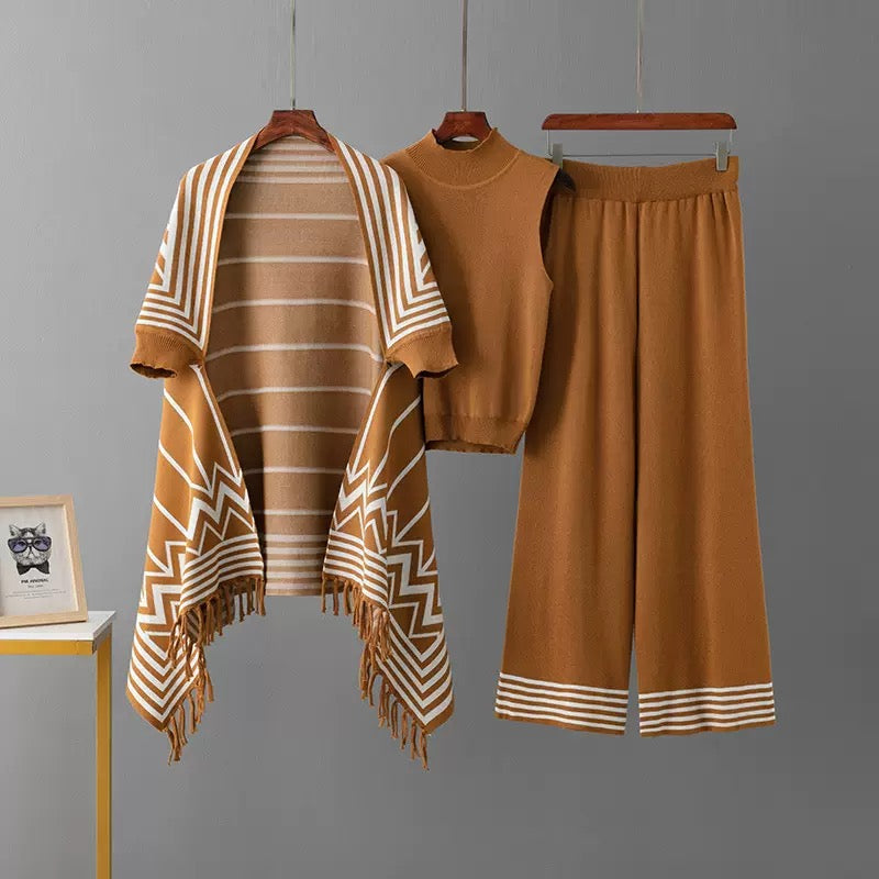 Camel 3-piece knit co-ord set laid flat showing fringe cardigan, top, and pants
