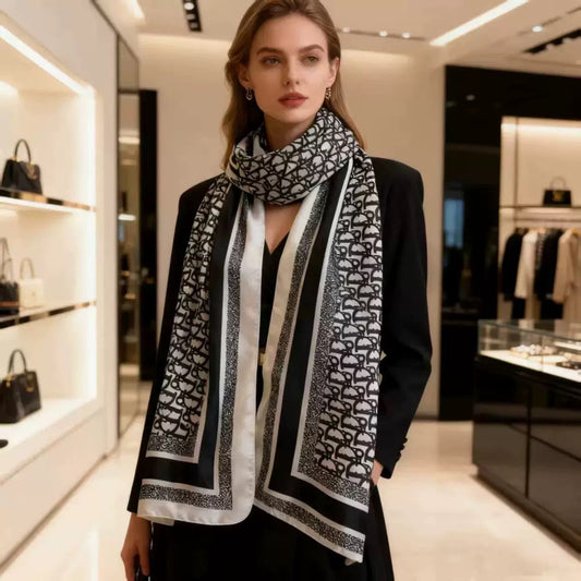 Woman wearing black designer logo print stole with blazer - professional luxury styling