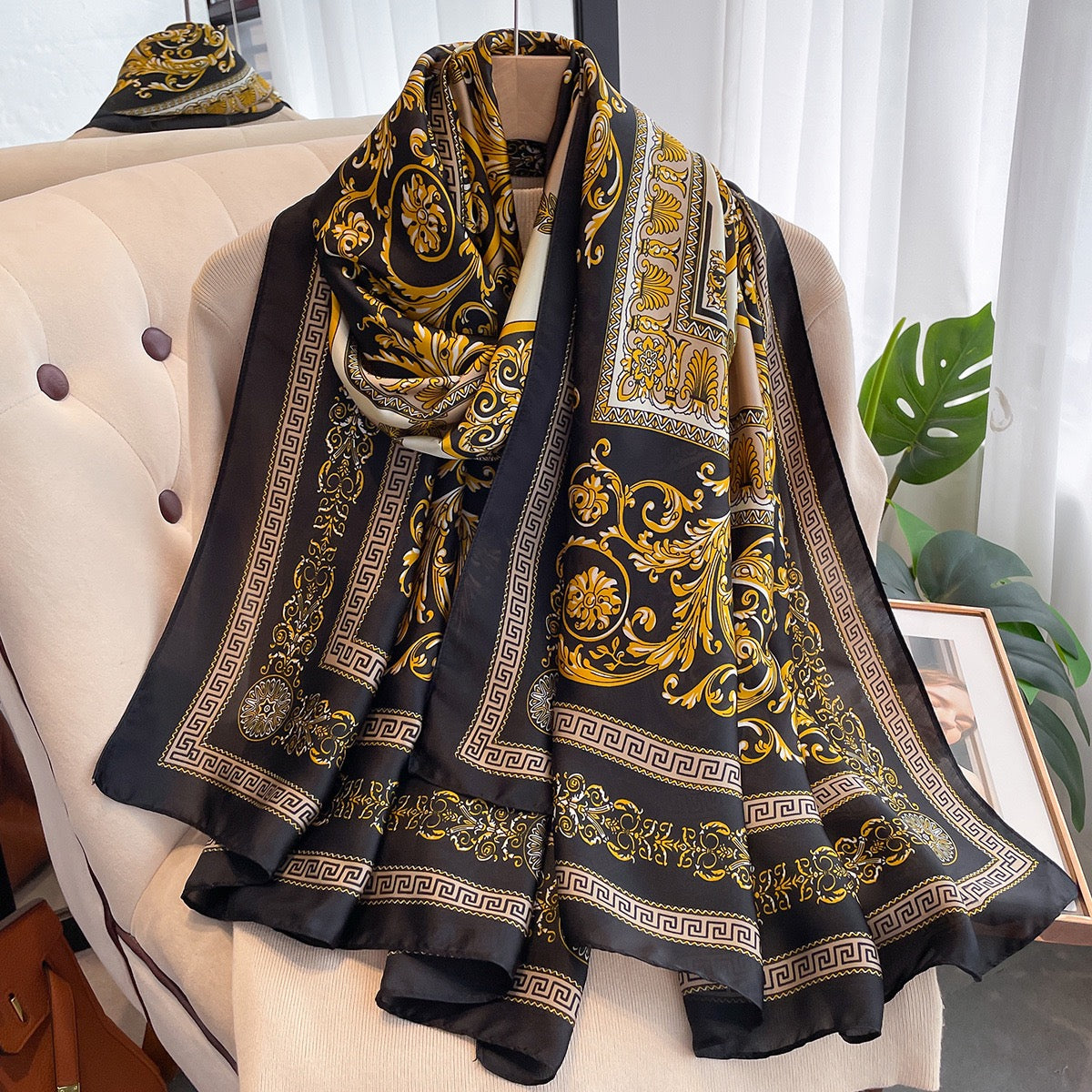 Black gold baroque print imitation silk scarf draped on mannequin - Greek key border luxury scarf